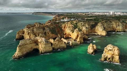 Ponta da Piedade sea stack and ocean cliff, Lagos Algarve Portugal with foam Video stock 346658462