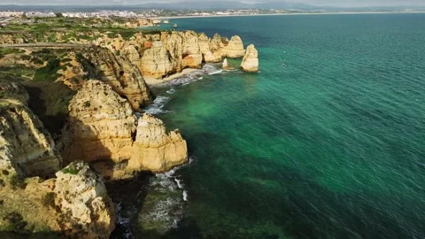 Ponta da Piedade sea stack and ocean cliff, Lagos Algarve Portugal with texture Video stock 346658474
