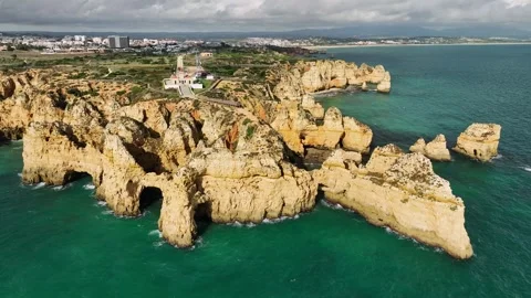 Ponta da Piedade sea stack and ocean cliff, Lagos Algarve Portugal with bay Video stock 346658482