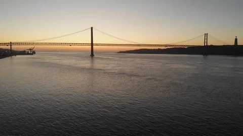 Ponte 25 de Abril Bridge in Lisbon, Portugal. Sunrise. Stock Footage 127687796