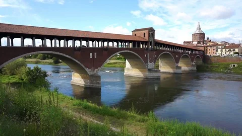Ponte Coperto (covered bridge) over ticino river in Pavia on a sunny day Stock Footage 129524902