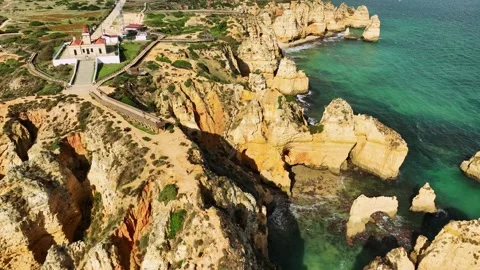 Ponte da Piedade sea stack and ocean cliff, Lagos Algarve Portugal with arch Stock Footage 344288431