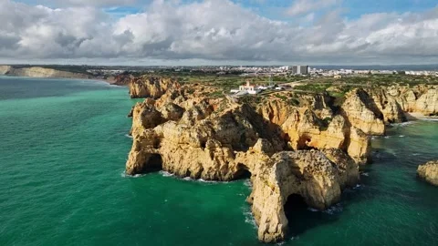 Ponte da Piedade sea stack and ocean cliff, Lagos Algarve Portugal with slope Stock Footage 344288434