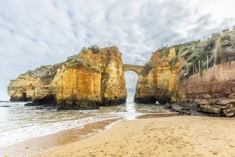 Ponte do Antigo Forte do Pinho Rock Arch at Praia dos Estudantes, Lagos, Al.. Photos