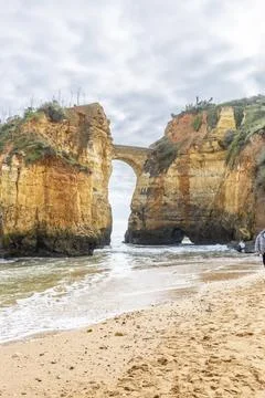 Ponte do Antigo Forte do Pinho Rock Arch at Praia dos Estudantes, Lagos, Al.. Stock Photos
