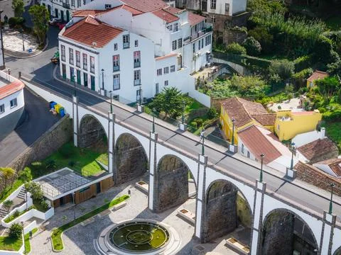 Ponte dos Sete Arcos old stone arch bridge in Nordeste town. Aerial drone view Foto stock