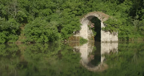 Ponte Romito Ruins on the Arno River - Wide shot pan right Stock Footage 240935656