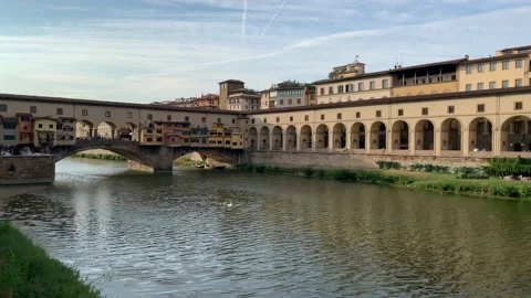 The Ponte Vecchio bridge in Firenze. Motion of river waves. Florence, Italy Stock Footage 159368300