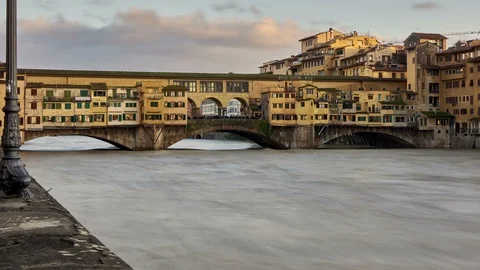 The Ponte Vecchio Bridge in Florence on the river Arno Stock Footage 122289546