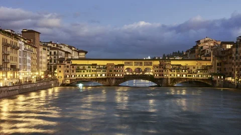 The Ponte Vecchio Bridge in Florence on the river Arno Stock Footage 122289898