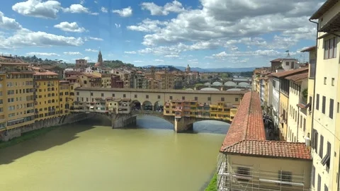 Ponte Vecchio, the famous medieval bridge, view from the Uffizi Gallery Palace Stock Footage 242146568