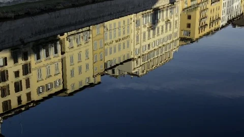 Ponte Vecchio in Florence. Camera moves from reflections on river to bridge Video stock 71091616