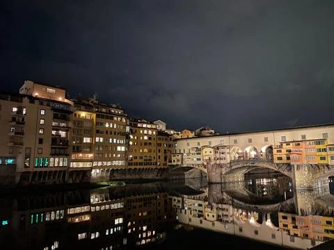 Ponte Vecchio Reflected in Arno River at Night Stock Photos