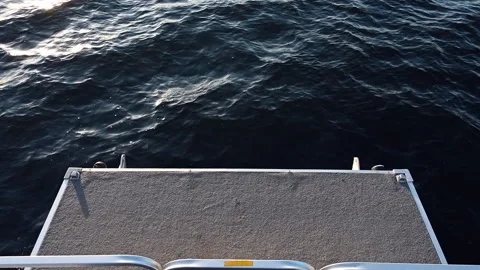 Pontoon bow slow-motion over small waves Stockbeeldmateriaal 130540345