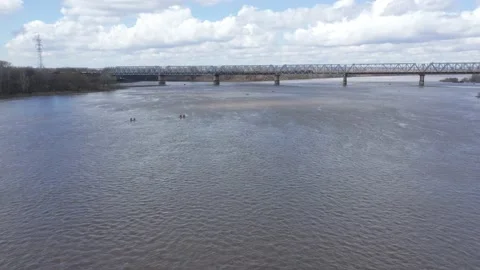 The pontoon bridge, through which transport passes, connects two settlements Stock Footage 153480551