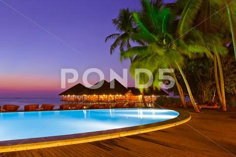 Pool and cafe on tropical Maldives island Stock Photos