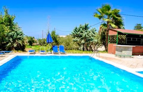 Pool and umbrella Stock Photos