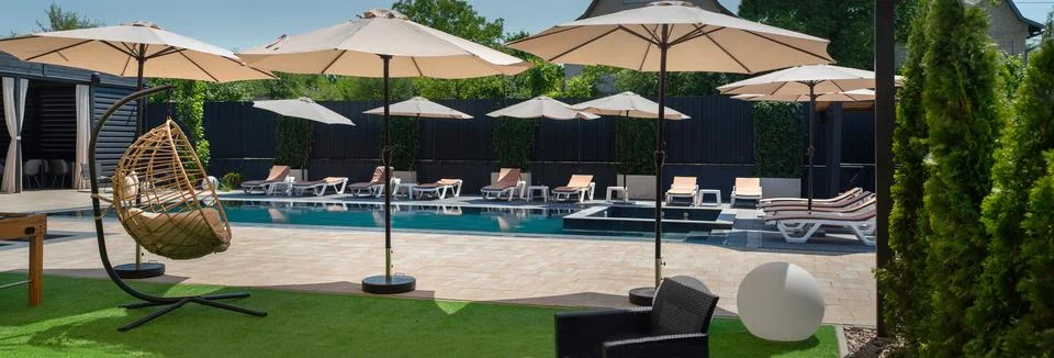 Pool and umbrellas, panoramic view Stock Photos