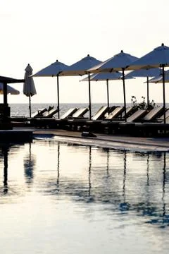 Pool and umbrellas Stock Photos