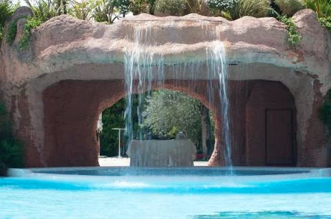 Pool and waterfall in hotel Stock Photos