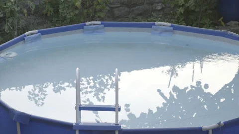Pool in the backyard at sunset Stock Footage 160147468