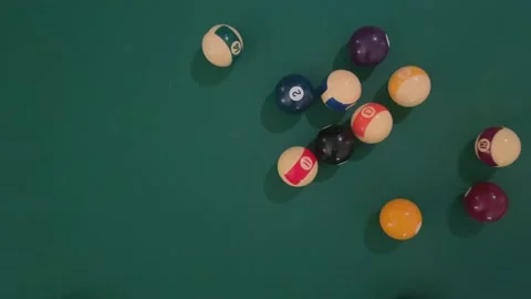 Pool balls in triangle dispersed by white ball Stock Footage 298056913