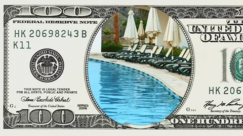 Pool beach beds and sunshields in 100 dollar bill Stock Footage 97198207