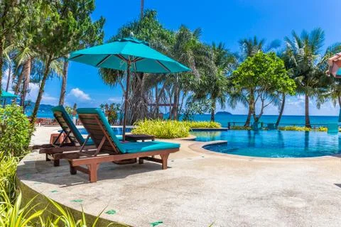 Pool bed with coconut trees and beautiful beach as background at Koh Chang Stock Photos