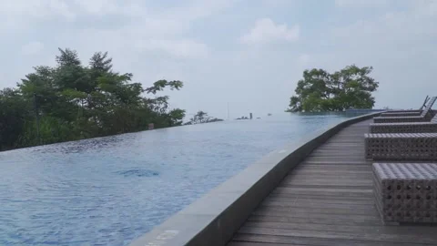 A pool with benches and trees Stock Footage 236890039