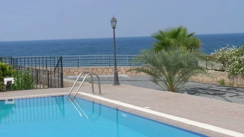 Pool with blue turquoise water on background of sea. concept of summer holidays Stock Footage 134603843