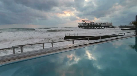 Pool with blue water on the beach in Sochi amid storm in the Black sea Vidéo 48988658