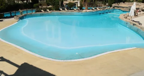 Pool with blue water without people, Resort, without tourists, clear water Stock Footage 169633764