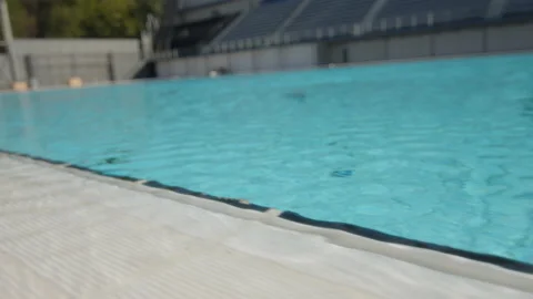 Pool border with turquoise water flowing over the tiles, in Barcelona, Spain Stock Footage 221107021