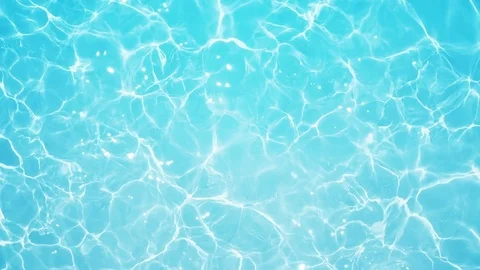 Pool caustics. Blue water with shining caustics in slow motion. Stock Footage 79996492