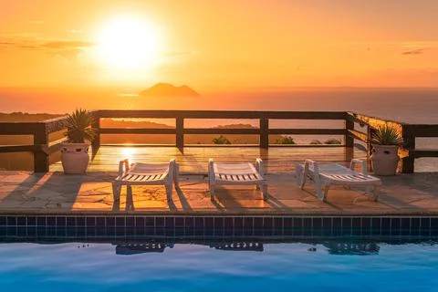 Pool Chairs on Sunset 스톡 사진