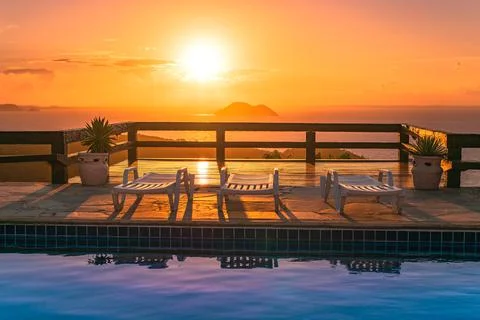 Pool Chairs on Sunset 스톡 사진