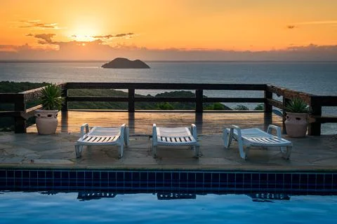 Pool Chairs on Sunset Fotos de archivo