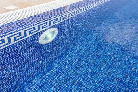 Pool with classical ceramic filled with water. With illuminator. Stock Photos