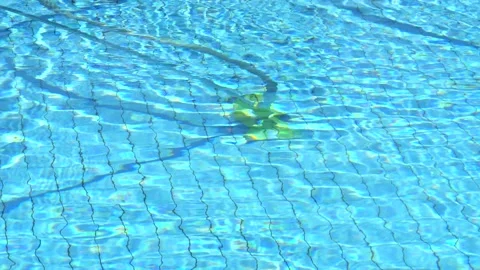 Pool cleaning, pool vacuum cleaner cleans and vacuums the bottom of the pool Stock Footage 130511808