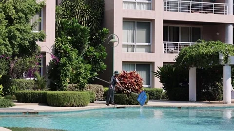 Pool Cleaning Process at Apartment Complex Stock Footage 277559717