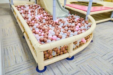 The pool is a close-up with colored plastic balls in the game room. With space Fotos de archivo