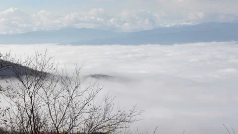 A pool of clouds below the mountains, Full HD 1080 Cinematic Video stock 146914944