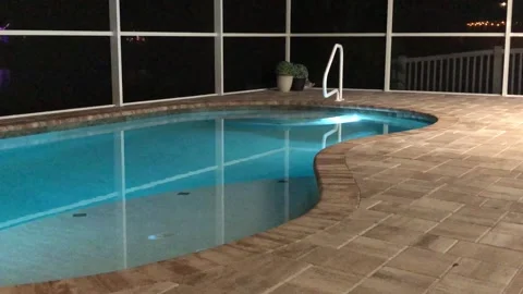 Pool with colored lights at night medium shot Video stock 260036240