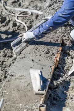 Pool Construction Worker Working With A Smoother Rod On Wet Concrete Stock Photos