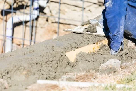 Pool Construction Worker Working With Wood Float On Wet Concrete Stock Photos