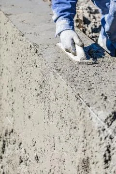 Pool Construction Worker Working With Wood Float On Wet Concrete Stock Photos