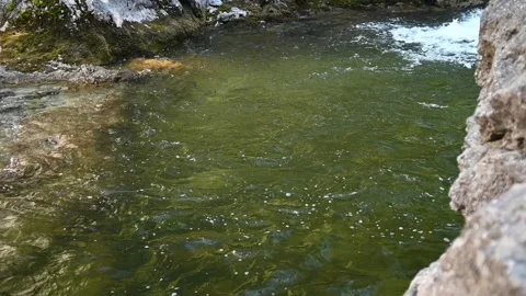 A pool created by a waterfall in the mountains (slow motion) Stock-Footage 219385609