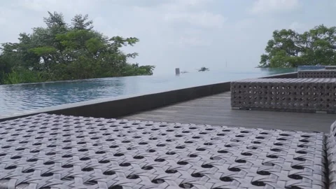 A pool with a deck and a bench Stock Footage 236890026