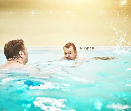 Pool, disability and learning with a swimming coach, personal trainer or teacher Stock Photos
