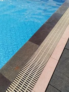 The pool edge channel or gutter. Stock Photos